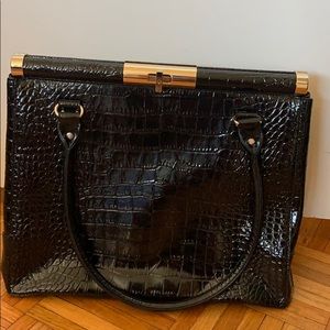 Black embossed leather shoulder bag